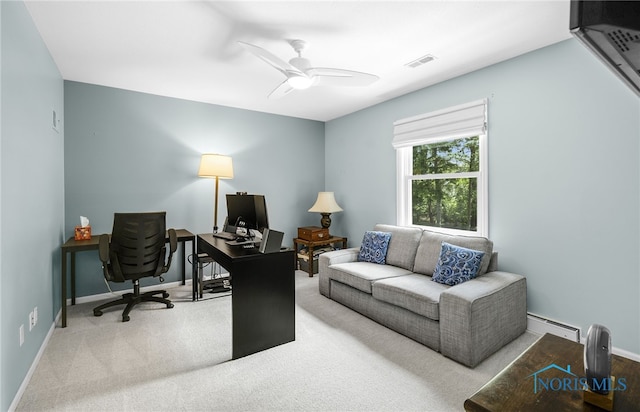 office area with ceiling fan, carpet, baseboards, and a baseboard radiator