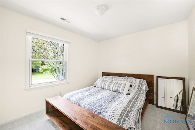 bedroom with carpet floors and baseboards