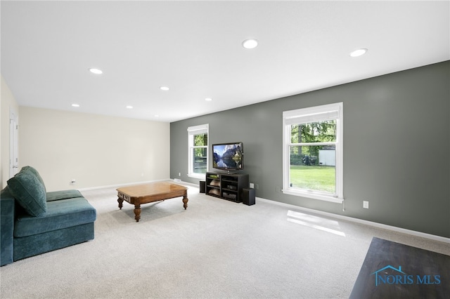 living area featuring carpet floors, recessed lighting, and baseboards
