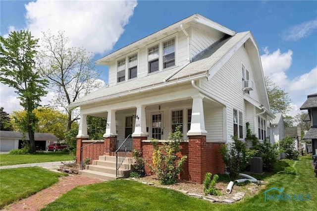 210 Lima Ave, Findlay, OH 45840 - view of front of home with central AC unit, a front lawn, covered porch, and brick siding