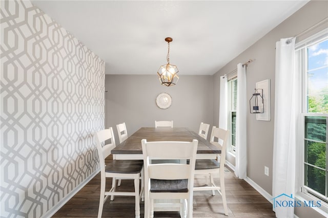 312 Fairmont Dr, Findlay, OH 45840 - dining room featuring wood finished floors, baseboards, and a chandelier