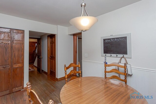 3757 N Mccord Rd, Toledo, OH 43617 - dining area featuring dark wood finished floors and wainscoting