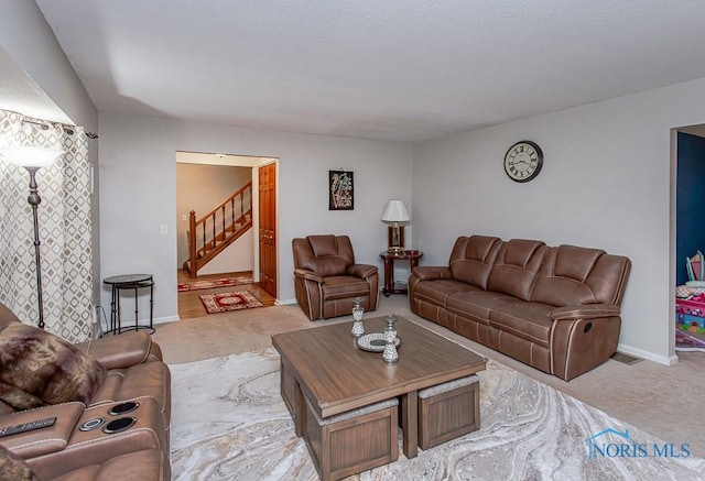 3757 N Mccord Rd, Toledo, OH 43617 - living area featuring light colored carpet, stairs, and baseboards