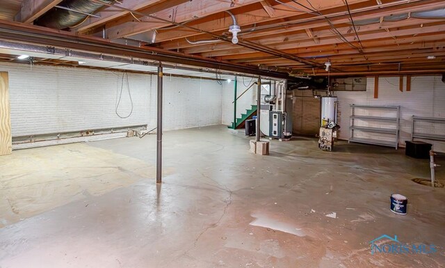 3757 N Mccord Rd, Toledo, OH 43617 - unfinished basement with stairway and gas water heater