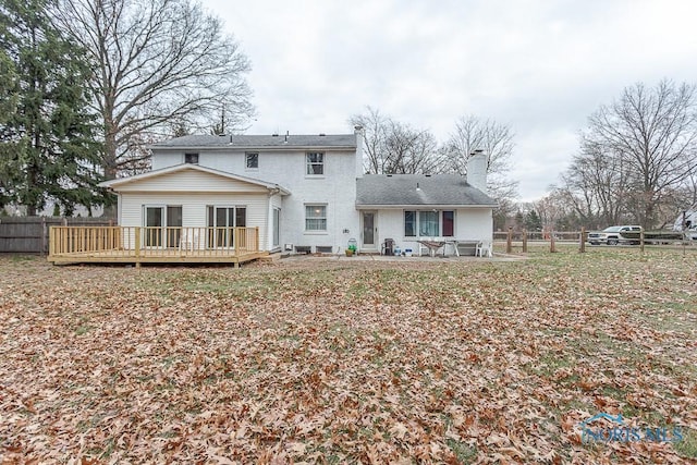 3757 N Mccord Rd, Toledo, OH 43617 - back of property featuring fence, a chimney, and a wooden deck