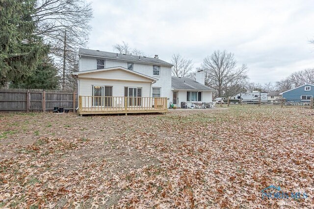 3757 N Mccord Rd, Toledo, OH 43617 - back of house featuring fence, a chimney, and a deck