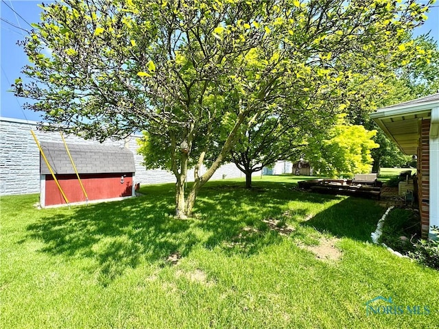 360 N Harmony Dr, Napoleon, OH 43545 - view of grassy yard featuring an outbuilding and a barn