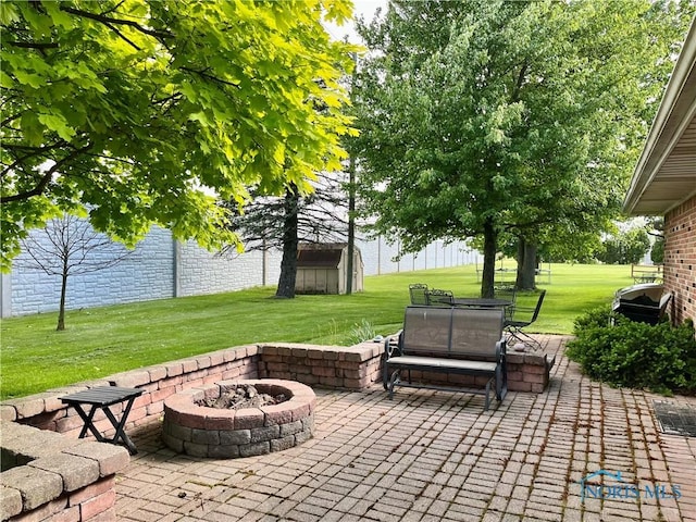 360 N Harmony Dr, Napoleon, OH 43545 - view of patio with a fire pit and an outdoor structure