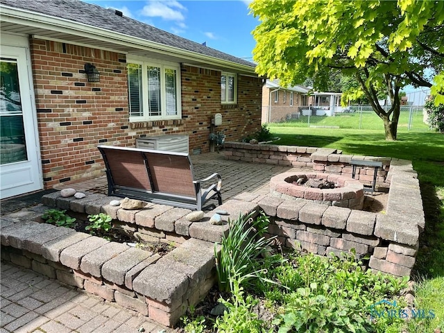 360 N Harmony Dr, Napoleon, OH 43545 - view of patio with an outdoor fire pit