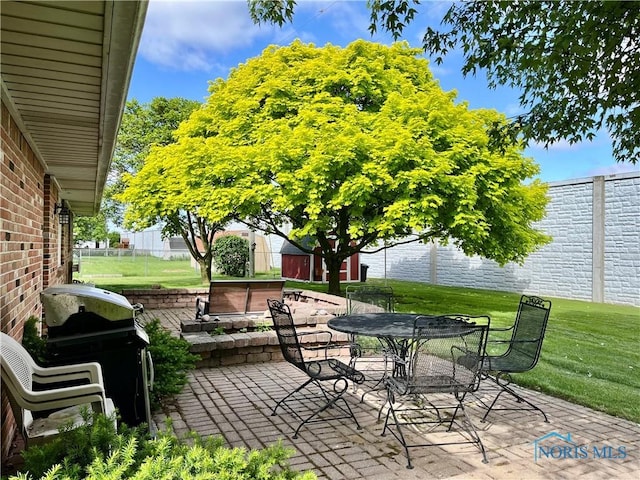360 N Harmony Dr, Napoleon, OH 43545 - view of patio / terrace featuring grilling area, a jacuzzi, and outdoor dining area