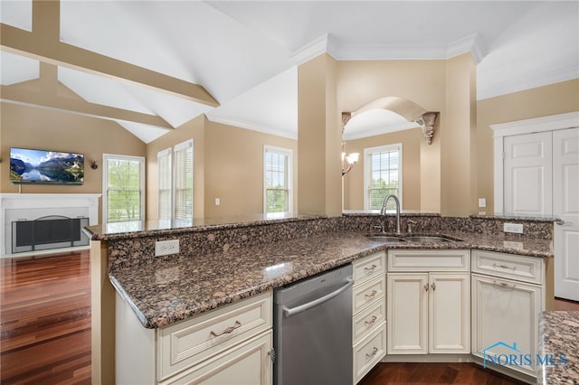 665 Meadowview Dr, Findlay, OH 45840 - kitchen featuring stainless steel dishwasher, a sink, dark wood finished floors, dark stone countertops, and a fireplace