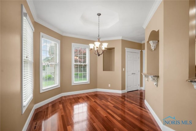 665 Meadowview Dr, Findlay, OH 45840 - unfurnished dining area with a chandelier, dark wood finished floors, baseboards, ornamental molding, and a tray ceiling
