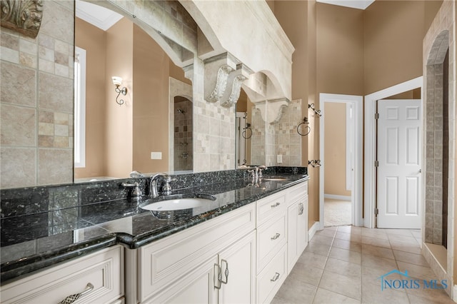 665 Meadowview Dr, Findlay, OH 45840 - full bathroom featuring tile patterned flooring, a tile shower, double vanity, and baseboards