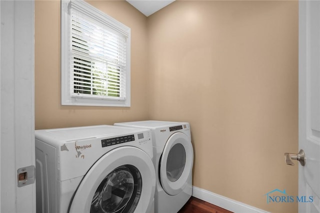 665 Meadowview Dr, Findlay, OH 45840 - clothes washing area with separate washer and dryer, baseboards, and dark wood-type flooring