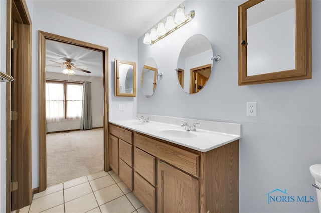 1330 Kennsington Dr, Findlay, OH 45840 - bathroom with ceiling fan, toilet, double vanity, and tile patterned flooring