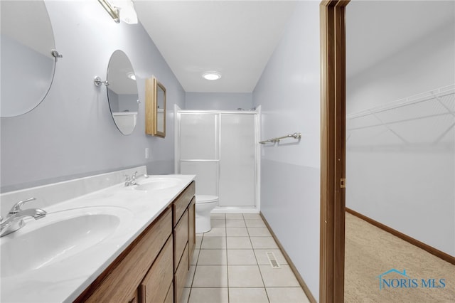 1330 Kennsington Dr, Findlay, OH 45840 - full bath featuring a stall shower, double vanity, toilet, tile patterned flooring, and baseboards