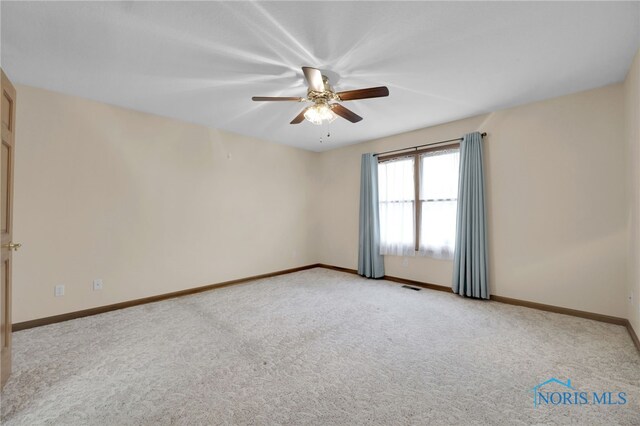 1330 Kennsington Dr, Findlay, OH 45840 - unfurnished room featuring a ceiling fan, light colored carpet, and baseboards