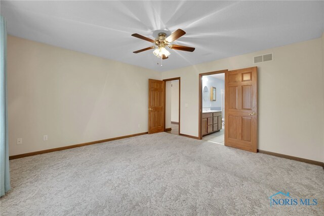 1330 Kennsington Dr, Findlay, OH 45840 - unfurnished bedroom with light carpet, baseboards, ceiling fan, and ensuite bathroom