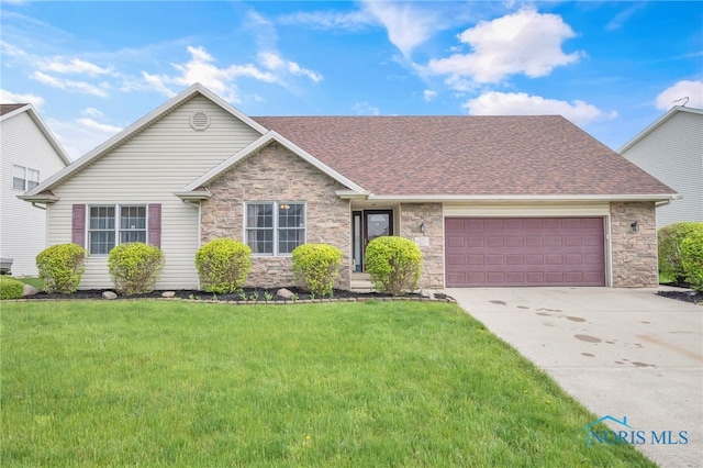 1330 Kennsington Dr, Findlay, OH 45840 - view of front of property with stone siding, driveway, an attached garage, a shingled roof, and a front lawn