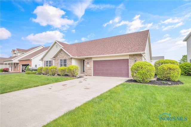 1330 Kennsington Dr, Findlay, OH 45840 - view of front of house featuring stone siding, a garage, concrete driveway, a front yard, and roof with shingles