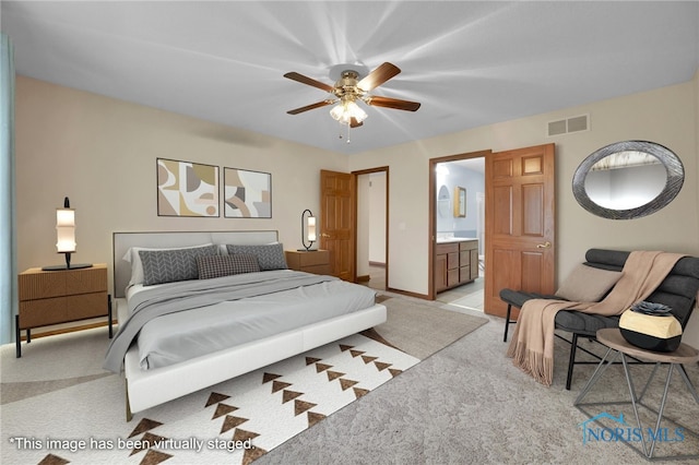 1330 Kennsington Dr, Findlay, OH 45840 - bedroom featuring light colored carpet, ensuite bathroom, baseboards, and ceiling fan
