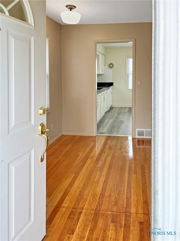 1381 Junior Dr, Maumee, OH 43537 - foyer featuring light wood finished floors and baseboards
