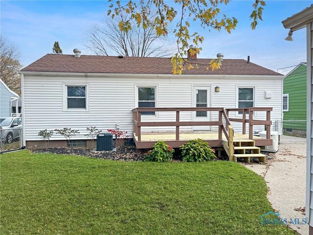 1381 Junior Dr, Maumee, OH 43537 - rear view of property featuring a deck, a chimney, central AC unit, and a shingled roof