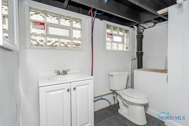940 Kingston Ave, Toledo, OH 43605 - bathroom with tile patterned flooring, toilet, and vanity