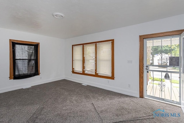 940 Kingston Ave, Toledo, OH 43605 - spare room with dark carpet and baseboards
