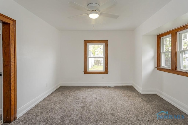 940 Kingston Ave, Toledo, OH 43605 - carpeted spare room featuring plenty of natural light, a ceiling fan, and baseboards