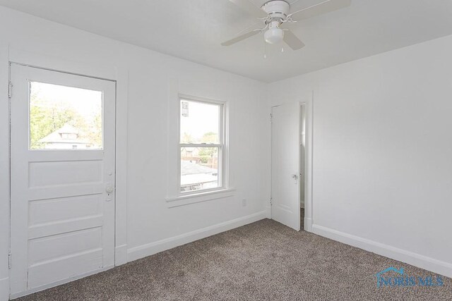 940 Kingston Ave, Toledo, OH 43605 - empty room featuring carpet floors, baseboards, and a ceiling fan