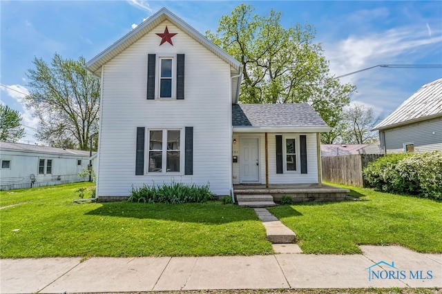 221 Poplar St, North Baltimore, OH 45872 - traditional-style home with a porch