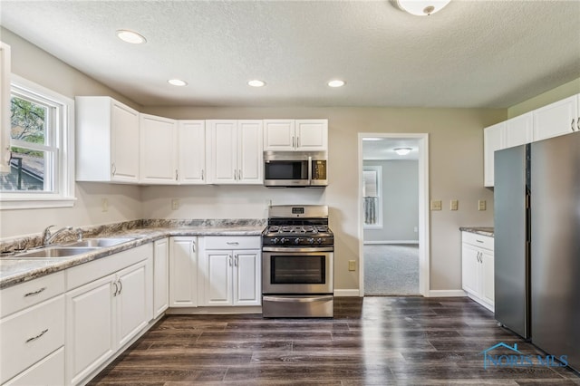 221 Poplar St, North Baltimore, OH 45872 - kitchen featuring stainless steel appliances, a sink, a textured ceiling, recessed lighting, and white cabinets