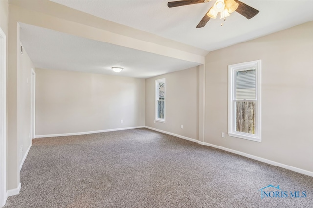221 Poplar St, North Baltimore, OH 45872 - empty room with carpet floors, a ceiling fan, and baseboards