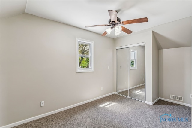 221 Poplar St, North Baltimore, OH 45872 - unfurnished bedroom with multiple windows, carpet flooring, baseboards, and a closet