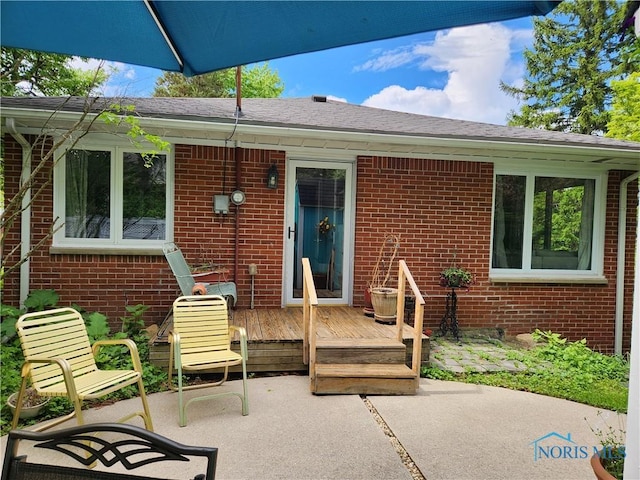 28330 W River Rd, Perrysburg, OH 43551 - back of property featuring brick siding, a deck, and a patio