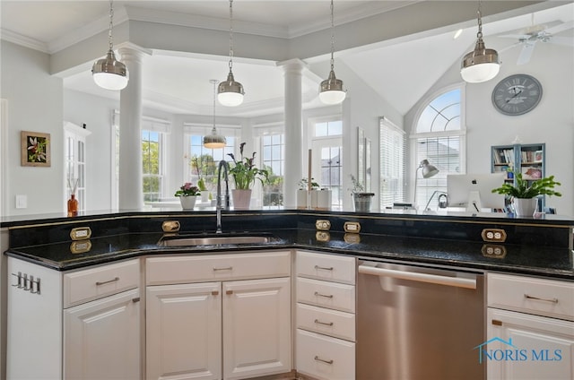 kitchen with dishwasher, a sink, healthy amount of natural light, ornate columns, and lofted ceiling