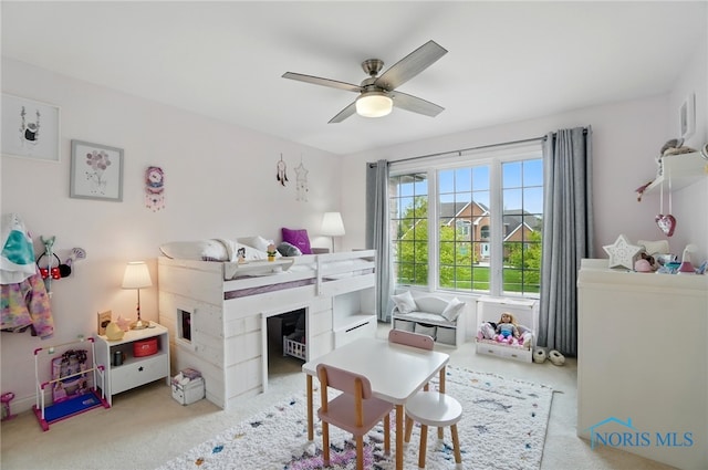 carpeted bedroom with ceiling fan