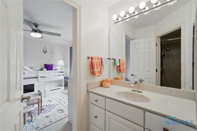 bathroom featuring a ceiling fan and vanity