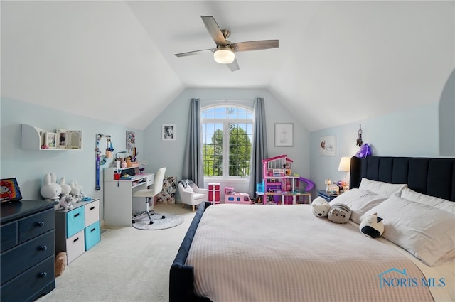 carpeted bedroom featuring a ceiling fan and vaulted ceiling