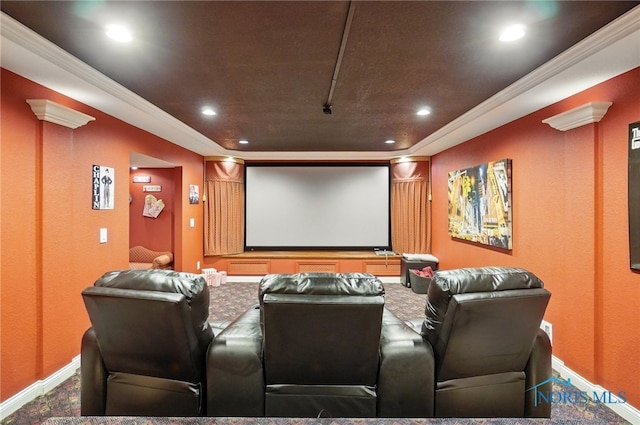 carpeted home theater with baseboards, recessed lighting, and ornamental molding
