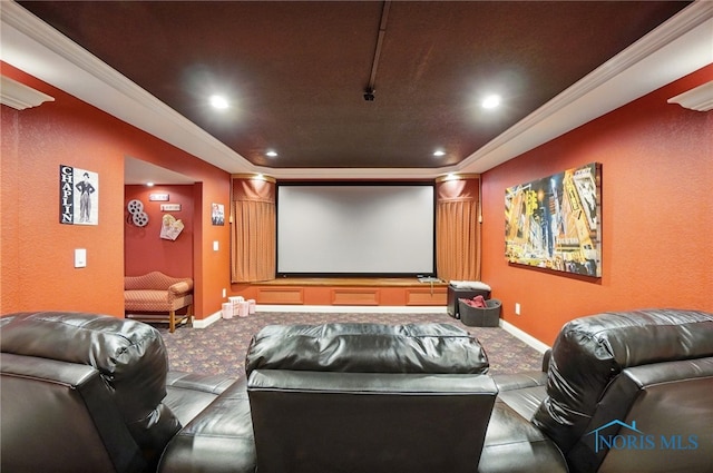 home theater room with carpet floors, recessed lighting, ornamental molding, a raised ceiling, and a textured wall
