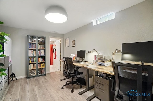 office space featuring light wood-style floors