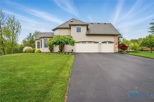 traditional home with asphalt driveway, a front yard, a garage, and a shingled roof