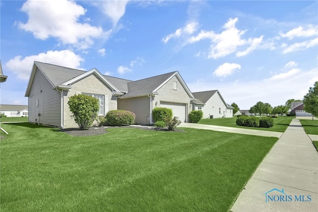 view of front of house featuring a front yard, an attached garage, concrete driveway, and brick siding