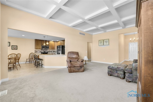 living room with coffered ceiling, baseboards, light colored carpet, beamed ceiling, and a chandelier