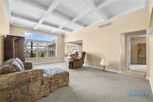 living area with coffered ceiling, carpet floors, beamed ceiling, and baseboards