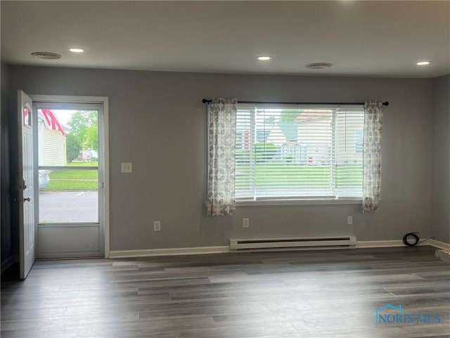 118 N Main St, Bloomdale, OH 44817 - unfurnished room with a baseboard radiator, wood finished floors, recessed lighting, and baseboards
