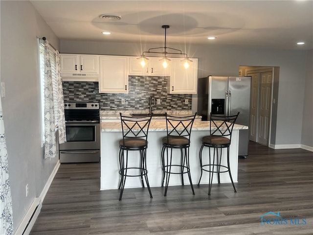 118 N Main St, Bloomdale, OH 44817 - kitchen featuring electric stove, under cabinet range hood, a baseboard radiator, baseboards, and recessed lighting