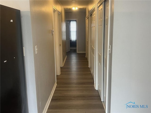 118 N Main St, Bloomdale, OH 44817 - corridor featuring dark wood finished floors and baseboards